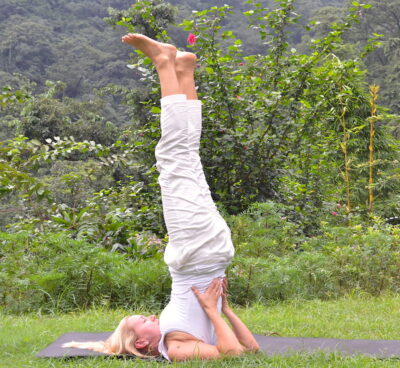 yoga poses - Liisa demonstrating full sarvangasana, the shoulder stand